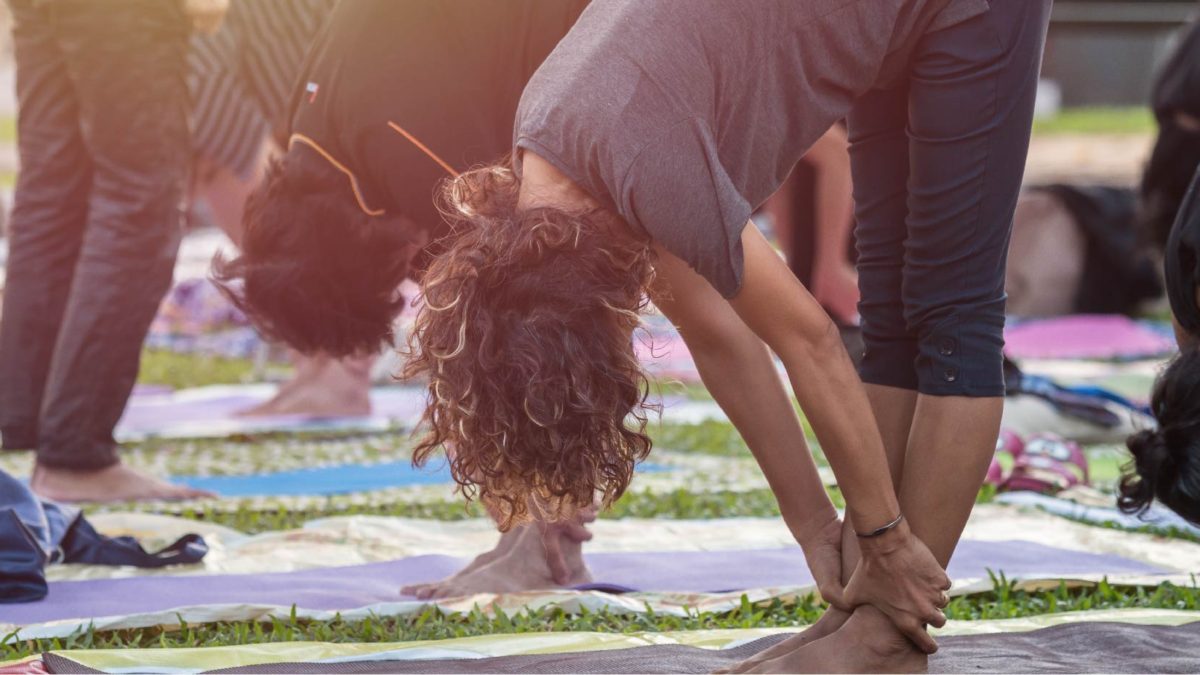 Woman doing yoga in stretching position.